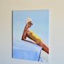 The subject reclines, her swimwear, swimming cap and of course, the car's fender, all scream of a bygone age of vintage style. The sea that captivates her gaze is unseen to us. The contrast in colours of the bright yellow and blues is uplifting, a healthy celebration of being outside. It is painted on a fine linen stretched canvas using the finest oils.