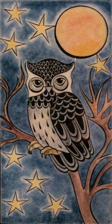 wise owl on tree branch left thumb