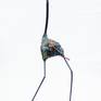 Bird made from recycled parts, clear resin, garden tools and objet trove