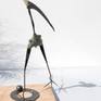 A migratory bird from northern Europe flies south in the winter.
“sculpture has one leg that move into 2 positions”