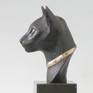 The famous Egyptian cat-sculptures inspired me to create this cat's head; and since it is not an ordinary cat it has a necklace, to give it a royal touch.
The stones on the necklace are mother of pearl, in a silver setting.