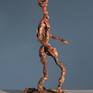 Alternate views reveal a sculpture in motion.