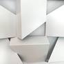 This artwork is the junction of a single geometric shape, based on a tubular steel structure, the visual effect is obtained by varying the position of the pieces and the empty spaces between them