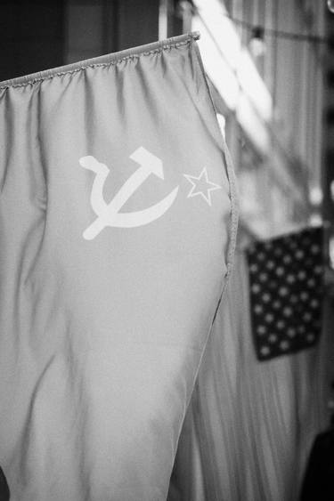 USSR red hammer and sickle flag next to US stars and stripes thumb