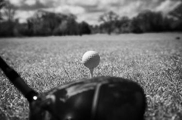 addressing golf ball with club on irish course thumb