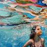 Girl swimming acrylic painting on panel in realistic style
