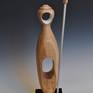 I have recently been interested in depicting the idea of vigilance or watchfulness in a series of sculptures
in wood. This is an abstract figurative form in the series. It is made from figured ash and the spear is aluminum and ash.