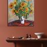 Bouquet of Sunflowers was inspired from Claude Monet's painting. It is a very vibrant painting displaying the colors of sunflowers in a white vase over a red carpet. Ideal to be displayed in any room of your house.