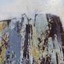 Detail emphasising how the top of the mountain face stands out starkly against the sky