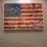 Painting of the USA flag on a deep wooden panel with a collage images or reflecting American culture fading in the background (showing extracts from the USA papers and magazines). Painted using oil paints and embellished with gold and silver stars. The painted is coated in thick resin for a glassy finish.