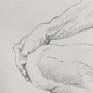 Detail of model’s hand on knee