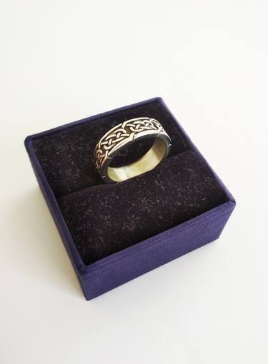Handmade silver ring with a complex ornament thumb
