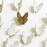 Detail of lace textured gold and white porcelain butterflies.