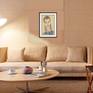 "Handsome Young Man" shown matted and framed in a room setting.