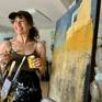 Contemporary latin-american artist Alicia Savio at her art studio working on her painting "Casa Vieja"