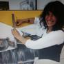 Contemporary latin-american artist Alicia Savio painting in her art studio