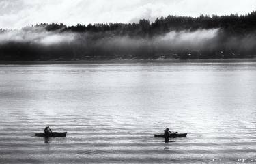 Two people kayaking on a misty morning thumb