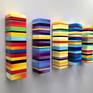 Hand made seamless and meticulously sanded blocks. These three sided color blocks can be viewed from 180 dg allowing it to be viewed from multiple angles in a room and or rooms. The pieces are spaced from the wall by a 1/4 inch giving them a floating, more dimensional effect. Each striped line consists of 2-4 colors faded into one another. This gives the work a bold unique look. Please feel free to contact me should you have any questions. Thank you.