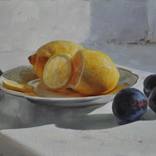 Still life with lemons and plums by Dmitriy Kalujni