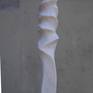 "Tower" is an abstract tall sculpture made of a beuatyful hard white-yellow-pink marble. It has a dynamical shape.
