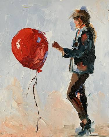 Young woman with a red air balloon thumb