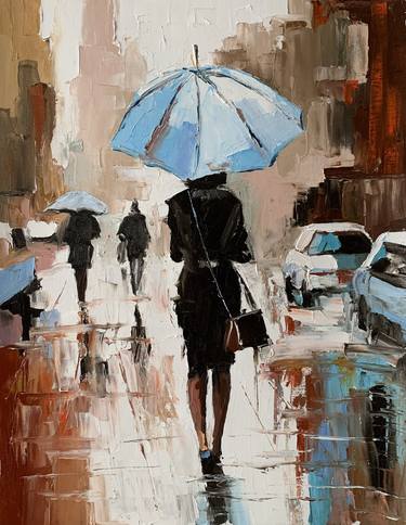 Woman with umbrella in a rainy city. thumb