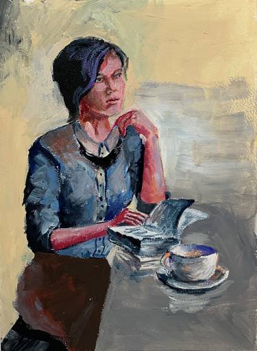 Young woman in a cafe. thumb