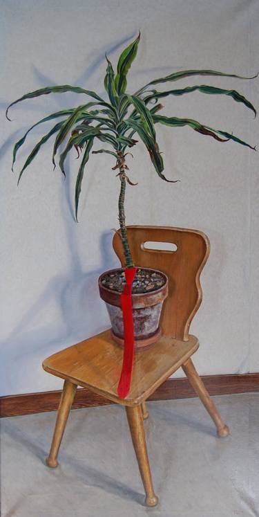 Plant on a chair with a red tie thumb