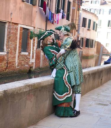 Couple in carnival costumes and mask on Venice carnival. thumb