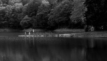 water reflections on a mountain lake thumb