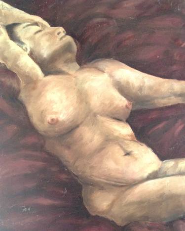 Lady reclining on maroon cushions thumb