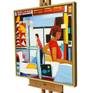 Painting in frame on large studio easel.