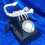 Scorpion Telephone, after all, Dali had his Lobster Telephone, so this is my version. A toy scorpion and an old Bakelite telephone from the 1950's, the telephone has all it's internal parts apart from the bells. It is not a functioning telephone, but looks good, The scorpion is removable from the main phone base.