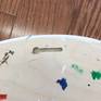Keyhole on back of panel, hangs flat against wall on a screw