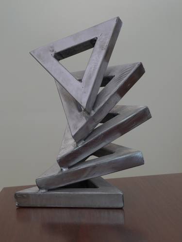 A stack of five steel triangles thumb