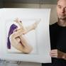 A contemplative pose inside a rigid square form, with each body part conforming to the geometry.