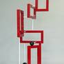 "Redtangle" is a powder coated, welded steel , geometric sculpture, inspired by the Russian Constructivism movement. It is suitable for placement indoors or outdoors (mounting clips for use outdoors, comes included).