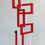 "Redtangle" is a powder coated, welded steel , geometric sculpture, inspired by the Russian Constructivism movement. It is suitable for placement indoors or outdoors (mounting clips for use outdoors, comes included).