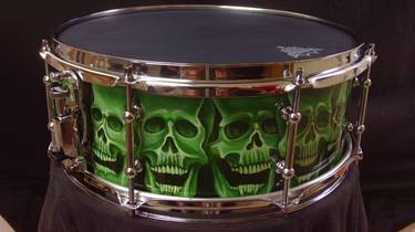 Skull drum thumb