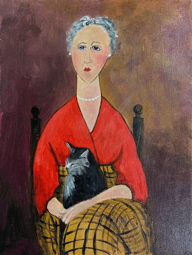 Grey haired woman with tabby cat thumb