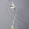 Hanging, patinaed copper wire with handmade paper and cast glass flowers.
