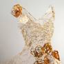 Unique, woven brass wire dress with paper and resin flowers, cast glass and gold leaf. Finished with resin and gold metal powders.