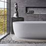 Born from Stone is a female nude stone carving in granite that looks quite as home in this luxury bathroom with a view.