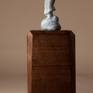 Bronze miniature sculpture of a woman bundled in her shawl and making her way through a winter storm. 
Bronze is 2.75″ H 
Available on large or small base.
Edition of 240