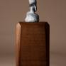 Bronze miniature sculpture of a woman bundled in her shawl and making her way through a winter storm. 
Bronze is 2.75″ H 
Available on large or small base.
Edition of 240