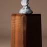 Bronze miniature sculpture of a woman bundled in her shawl and making her way through a winter storm. 
Bronze is 2.75″ H 
Available on large or small base.
Edition of 240