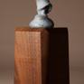 Bronze miniature sculpture of a woman bundled in her shawl and making her way through a winter storm. 
Bronze is 2.75″ H 
Available on large or small base.
Edition of 240
