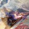 This is a many layered textured painting with multiple mediums.