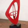 This sculpture, in red lacquered steel, echoes the movements of the planets.All one big perfectly tuned balancing act. Base in black stained Ash. Edition 1\6