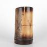 One of a series of vessel sculptures inspired by Nature. Natural vessel combining earthy elements of wood, metal, and stone crafted from sustainably harvested locally grown bamboo. Beautiful natural markings from growth preserved and enhanced with shou sugi ban (fire staining) technique. Copper metallic accents inspired by kintsugi (filling imperfections with precious metal). Natural quartz crystals wrapped in copper wire appear to be growing from the sheath scar at the base - a remnant of a branch.

5.875 inches H
3 inches W
